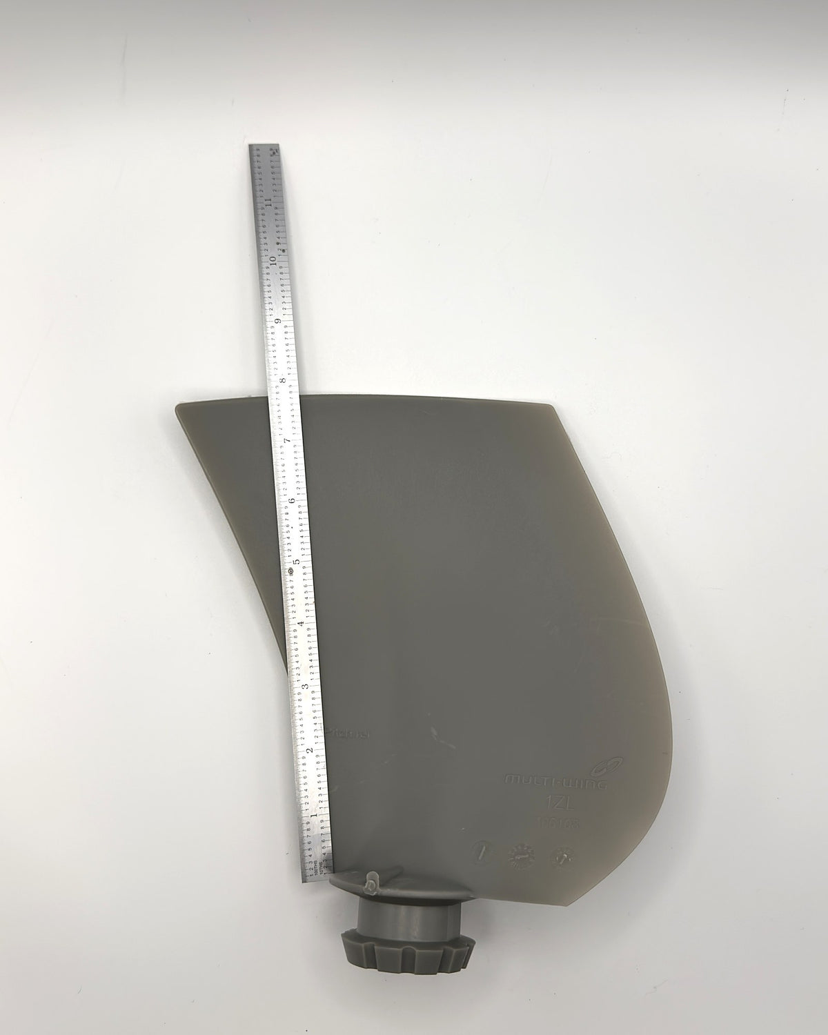 Multiwing 1ZL fan blade with a ruler along its length for scale