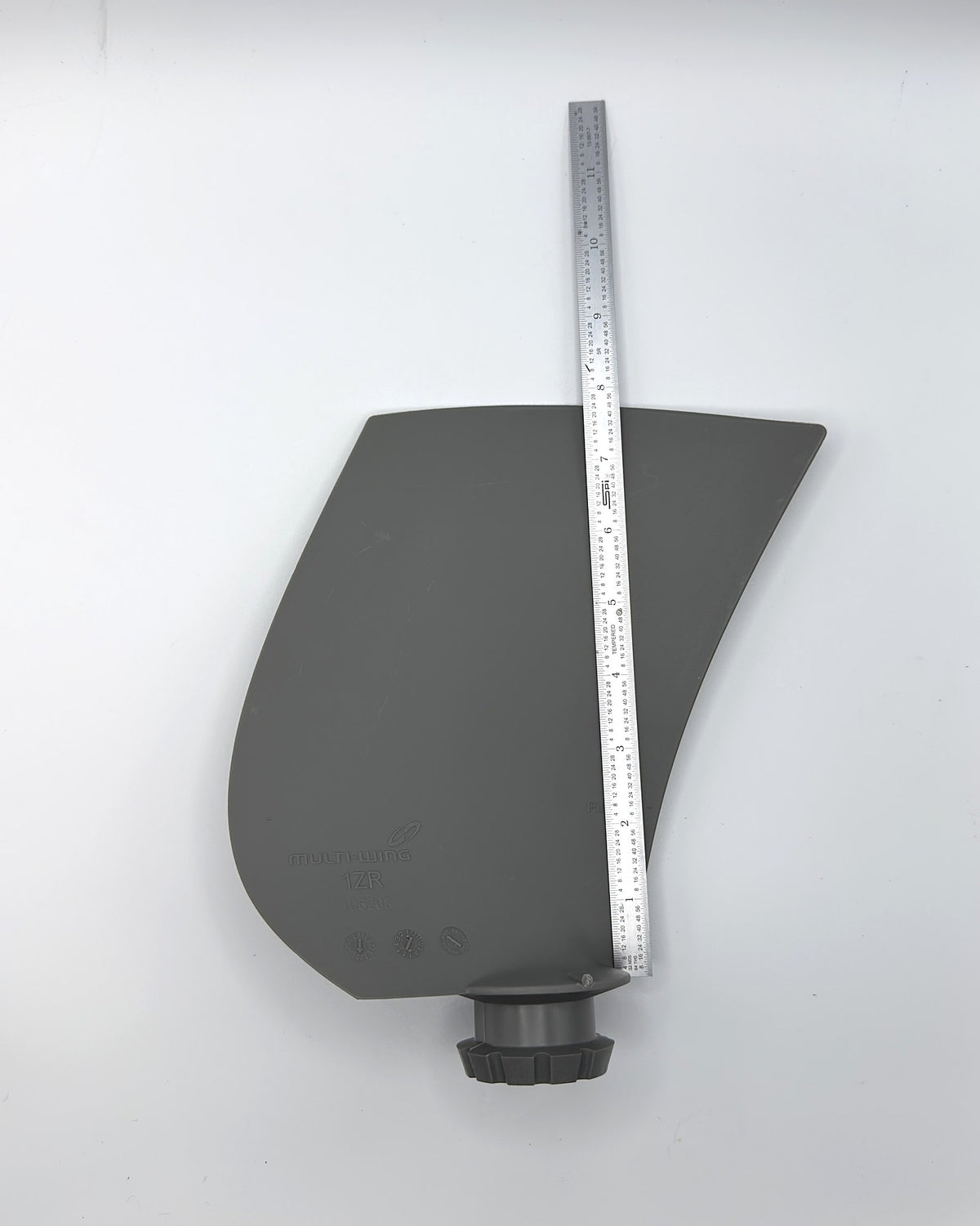 Multiwing 1ZR fan blade with a ruler along its length for scale
