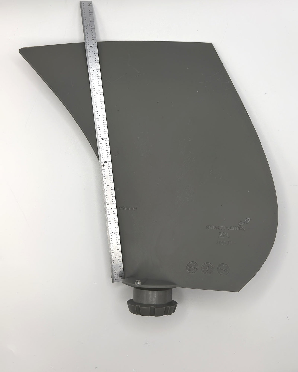 Multiwing 2ZL fan blade with a ruler along its length for scale