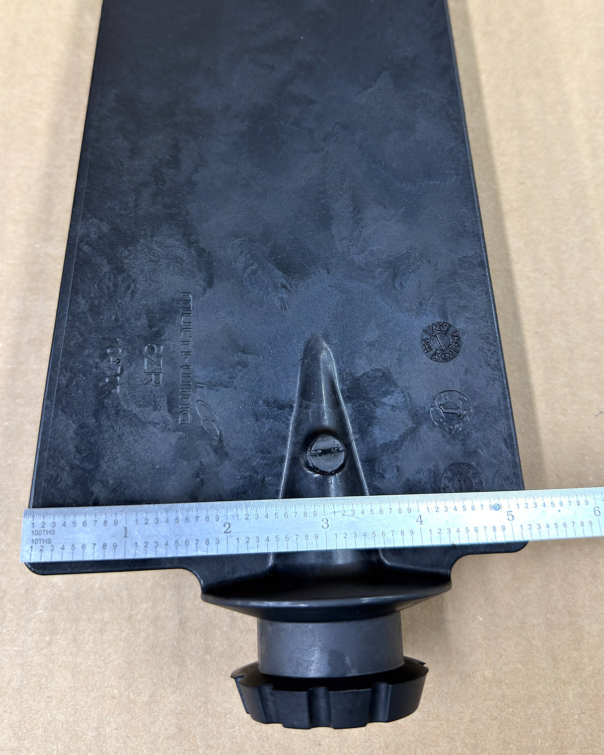 Multiwing 5ZR anti-static fan blade with a ruler across the root for width