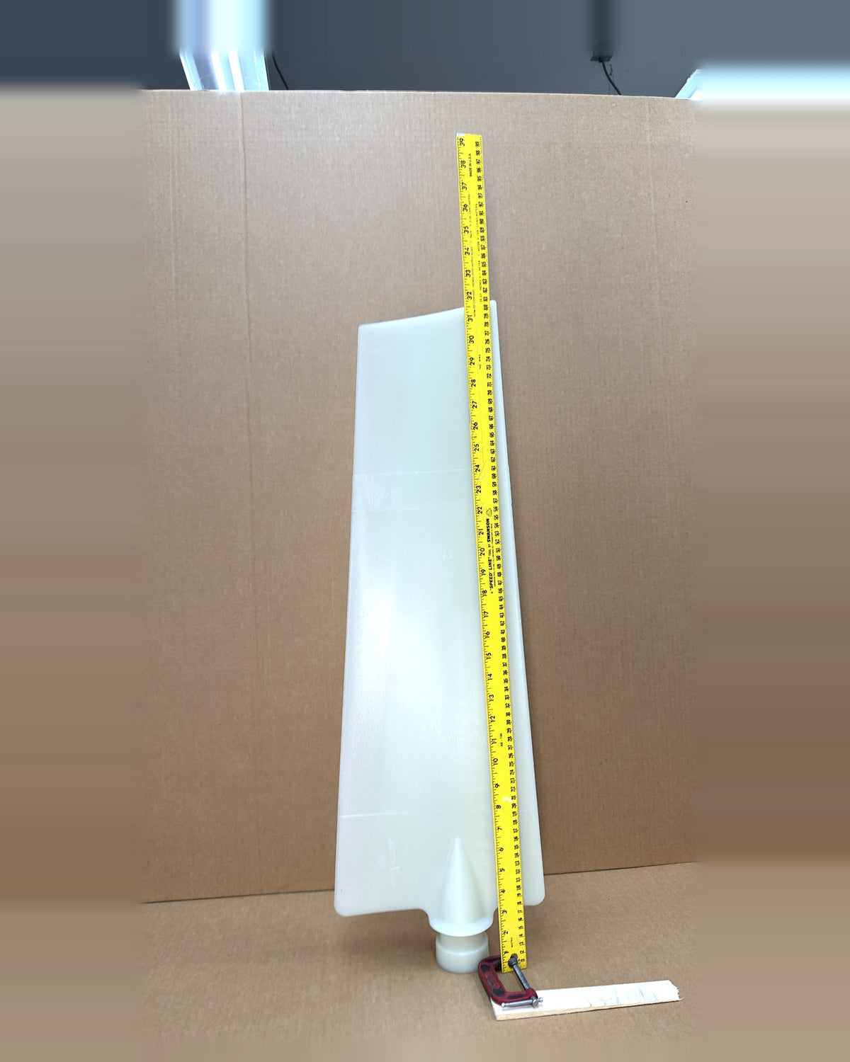 Multiwing 9WR fan blade, uncut, with tape measure showing length